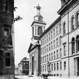 The original St. Francis Xavier College Church as it stood in the 1870s at its original location at the corner of Ninth Street and Lucas Avenue.